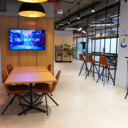 An image of the Greater Nexus 5th Floor Coworking Floating Area converted to a FIFA World Cup Watch & Work. Just 10 minutes away from JFK airport, Greater Nexus offers this public space for football/soccer fans. Don't miss out on watching USA, Mexico, Canada, Argentina, France & Portugal, and don't miss out on your favorite stars like Messi, Cristiano Ronaldo and Mbappe. To be streamed by FOX Sports app!